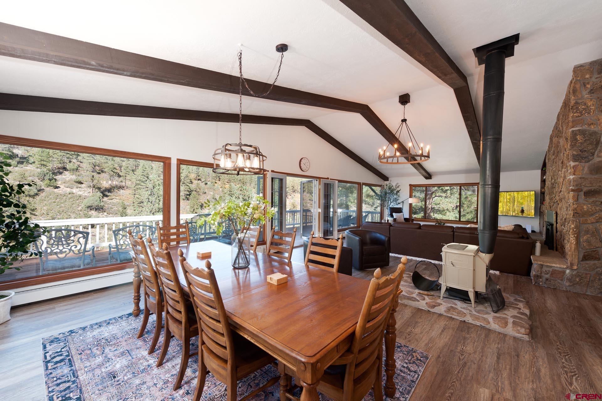 19 Newland Circle Durango, CO 81301 - Photo 15 of 44 a view of a dining room with furniture window and wooden floor