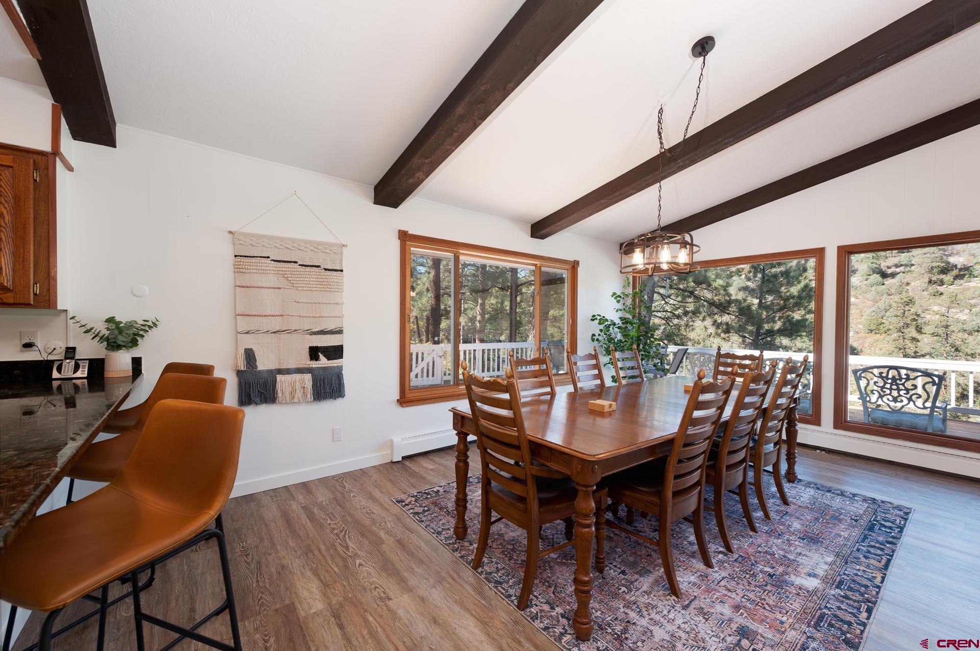 19 Newland Circle Durango, CO 81301 - Photo 18 of 44 a view of a dining room with furniture window and wooden floor