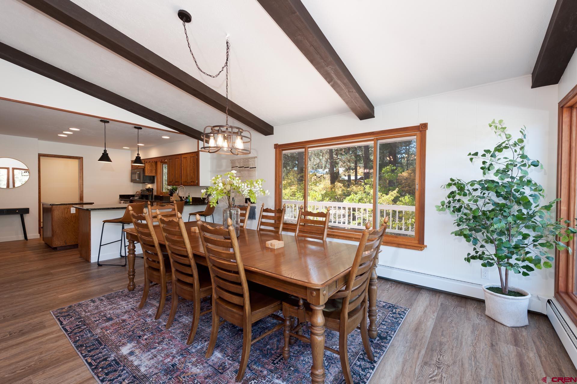 19 Newland Circle Durango, CO 81301 - Photo 19 of 44 a view of a dining room with furniture window and wooden floor