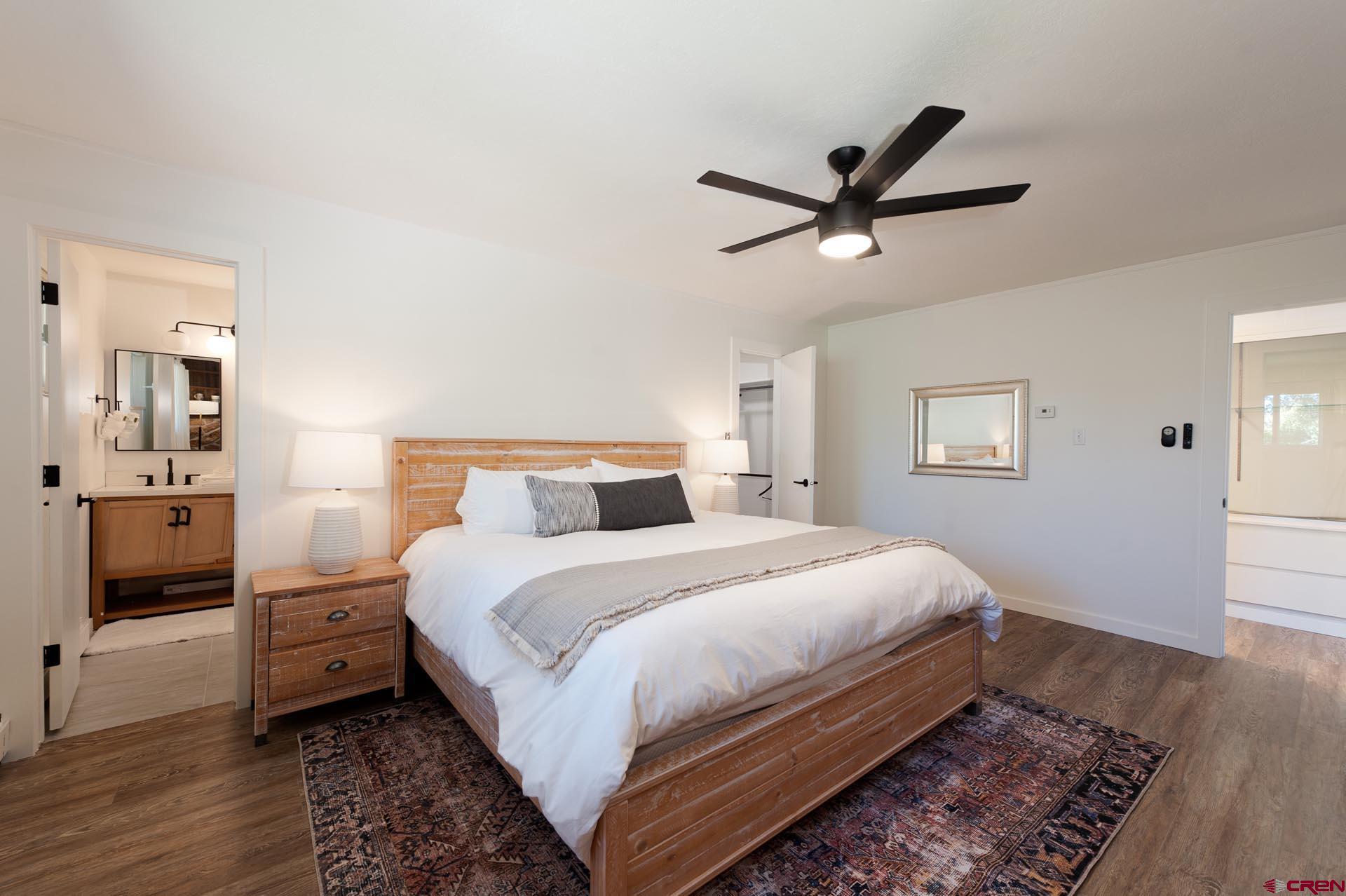 19 Newland Circle Durango, CO 81301 - Photo 22 of 44 a bedroom with a bed and a view of bathroom