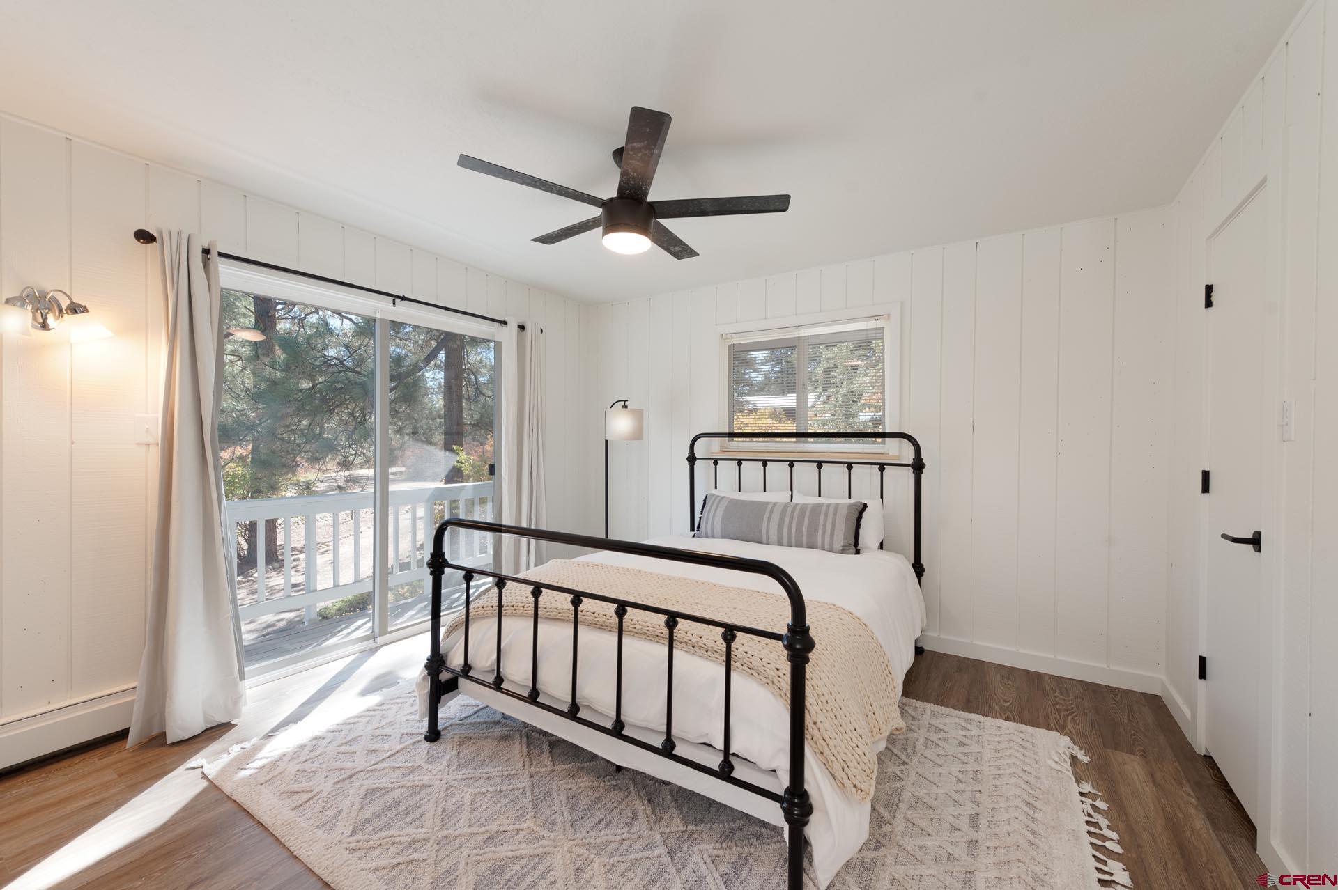 19 Newland Circle Durango, CO 81301 - Photo 27 of 44 a bedroom with a bed and a large window