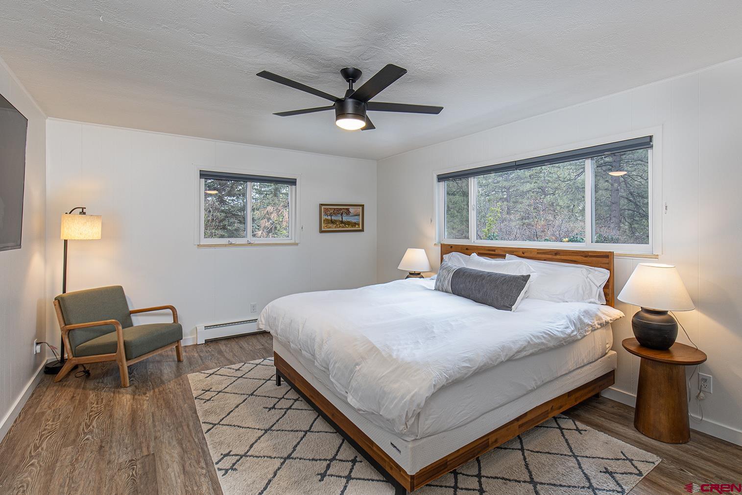 19 Newland Circle Durango, CO 81301 - Photo 29 of 44 a bedroom with a bed and wooden floor