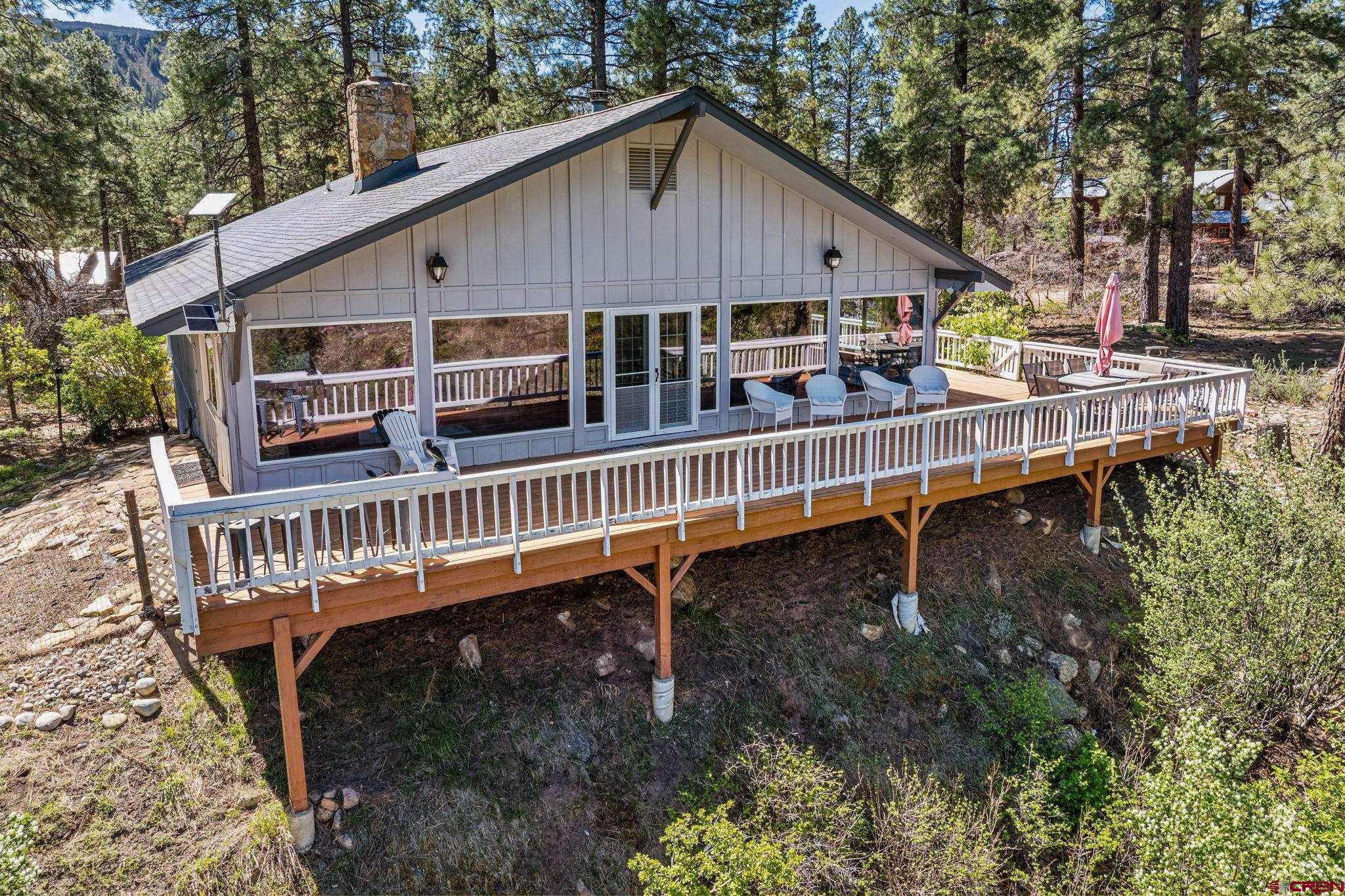 19 Newland Circle Durango, CO 81301 - Photo 3 of 44 a balcony with tall trees in front of it