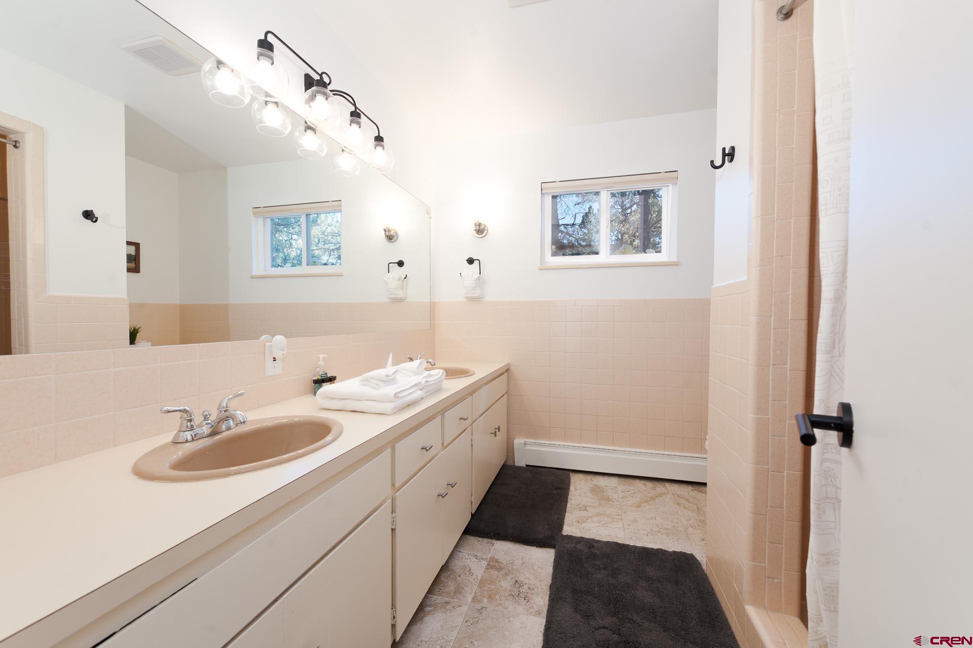 19 Newland Circle Durango, CO 81301 - Photo 35 of 44 a bathroom with a sink and a mirror