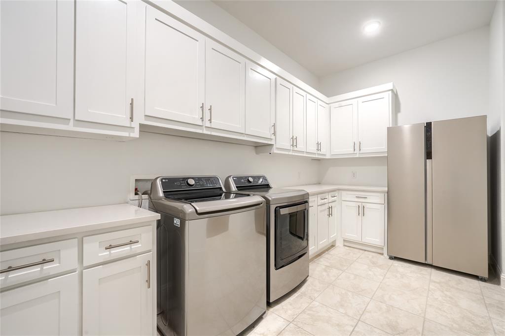 462 Infinito Drive Sunnyvale, TX 75182 - Photo 20 of 37 Laundry room featuring washer and dryer and cabinet space