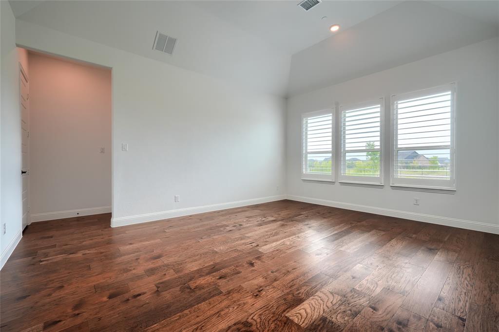 462 Infinito Drive Sunnyvale, TX 75182 - Photo 33 of 37 Spare room featuring dark wood finished floors, vaulted ceiling, and recessed lighting