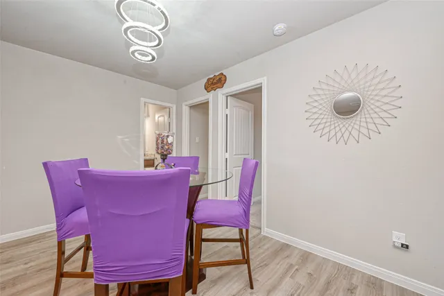 a view of a livingroom with furniture and wooden floor