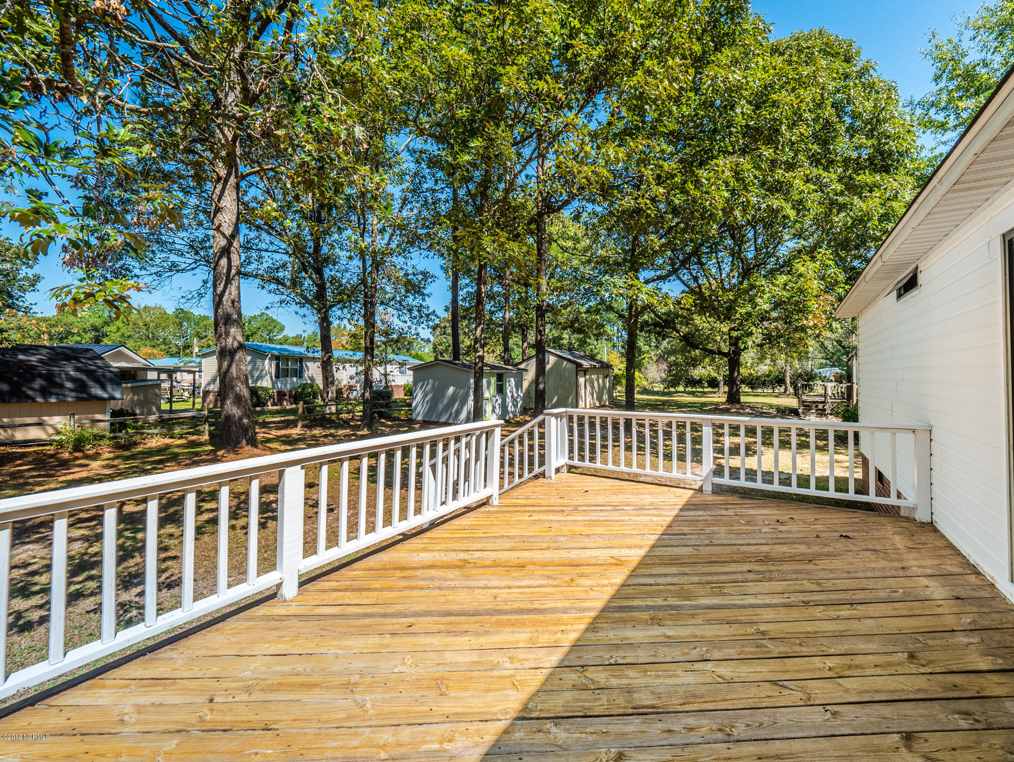 211 Doe Ridge Road Hampstead, NC 28443 - Photo 11 of 27 Large Sunning Deck in Back
