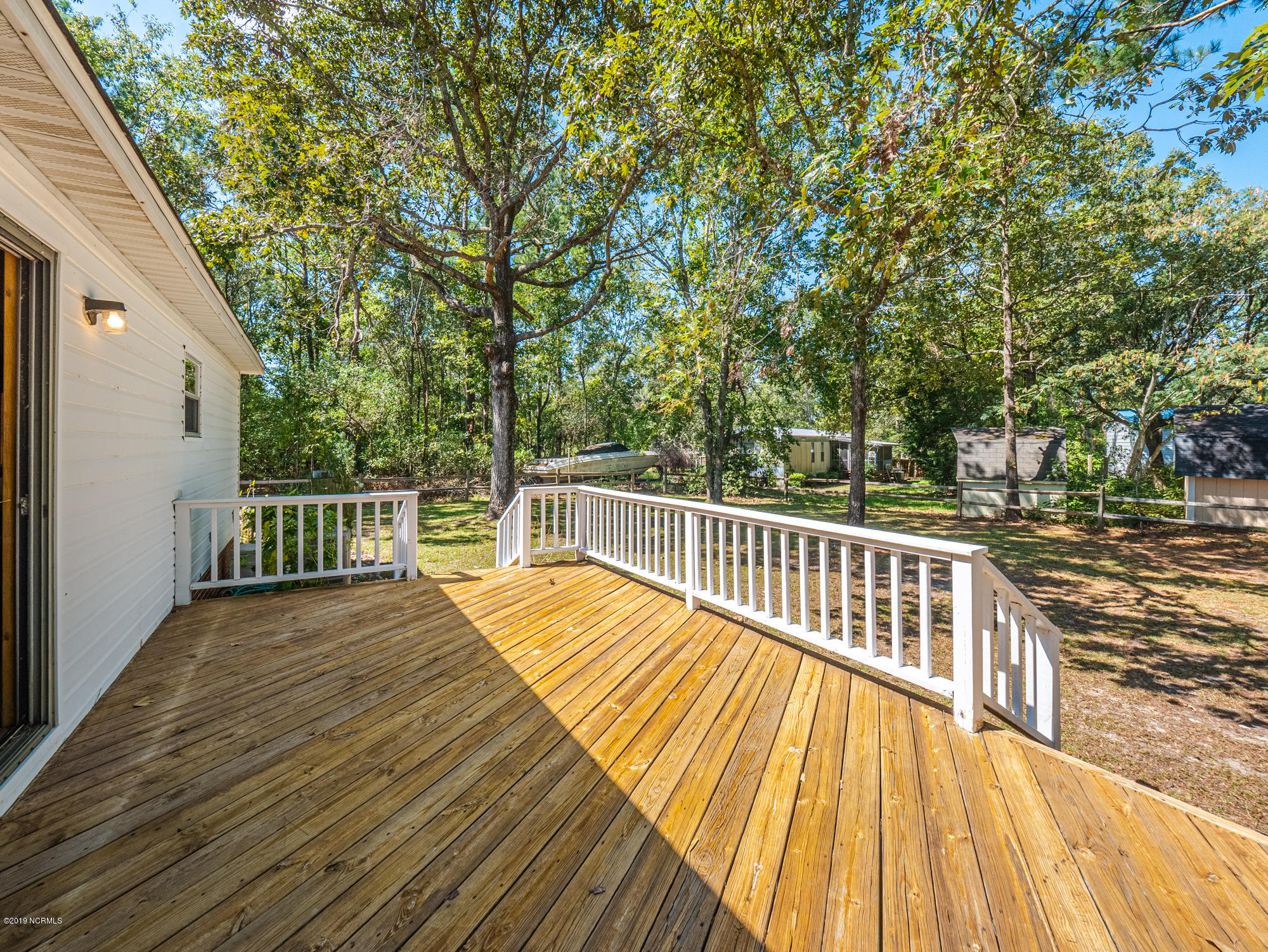 211 Doe Ridge Road Hampstead, NC 28443 - Photo 12 of 27 View of sunning deck