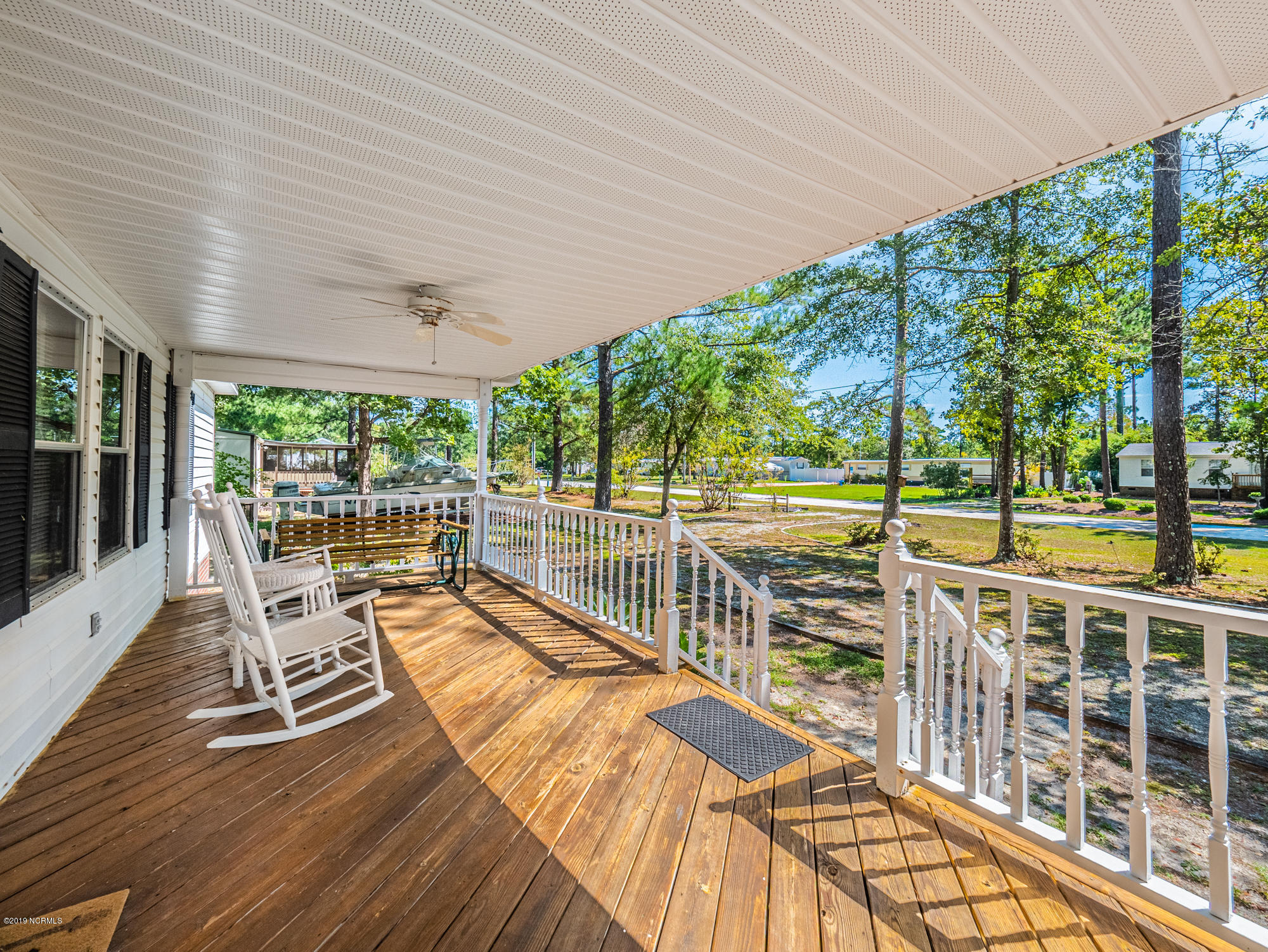 211 Doe Ridge Road Hampstead, NC 28443 - Photo 20 of 27 Shaded Covered Front Porch