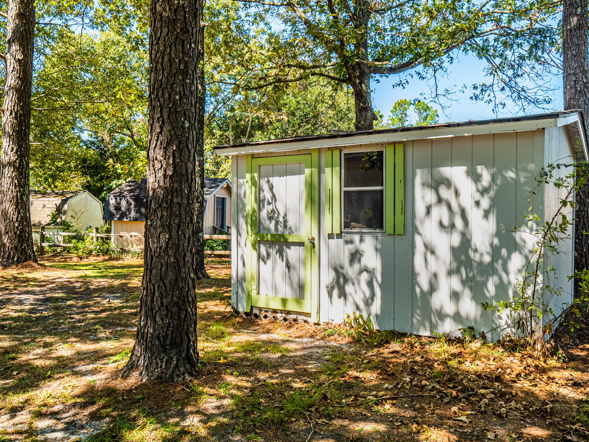 211 Doe Ridge Road Hampstead, NC 28443 - Photo 21 of 27 Storage Shed out back for all your lawn tools