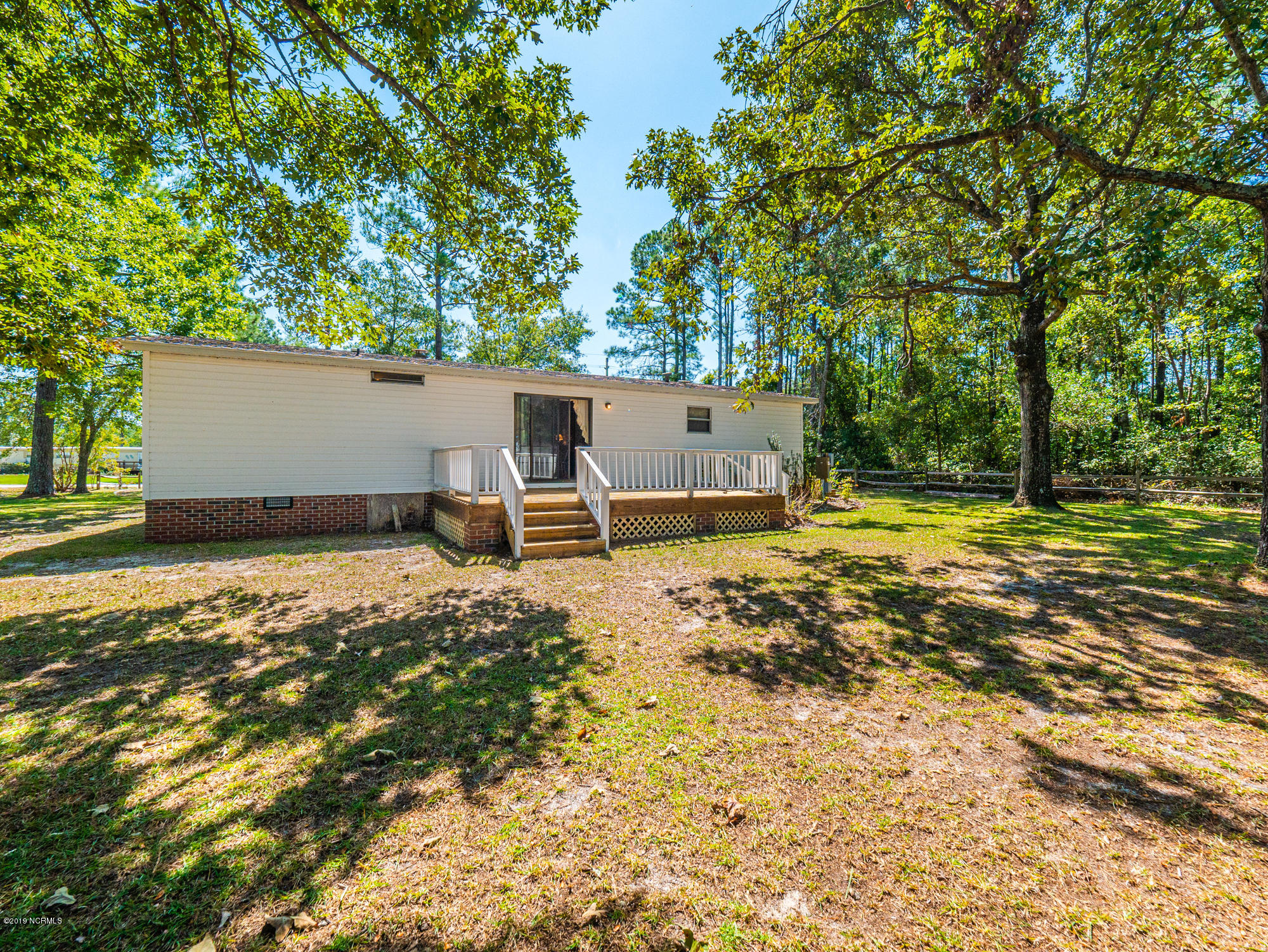 211 Doe Ridge Road Hampstead, NC 28443 - Photo 23 of 27 Another view of the back of home from spacious backyard