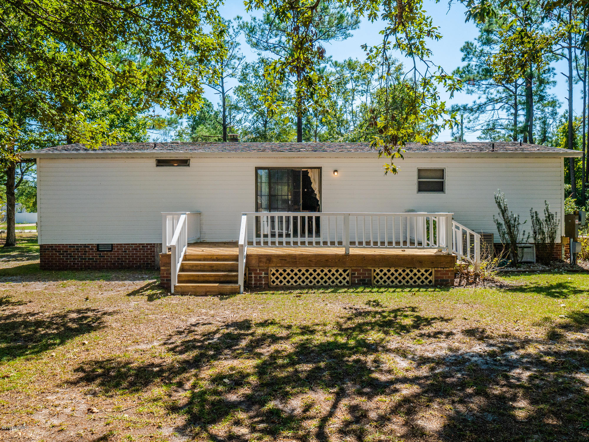 211 Doe Ridge Road Hampstead, NC 28443 - Photo 24 of 27 View of back deck