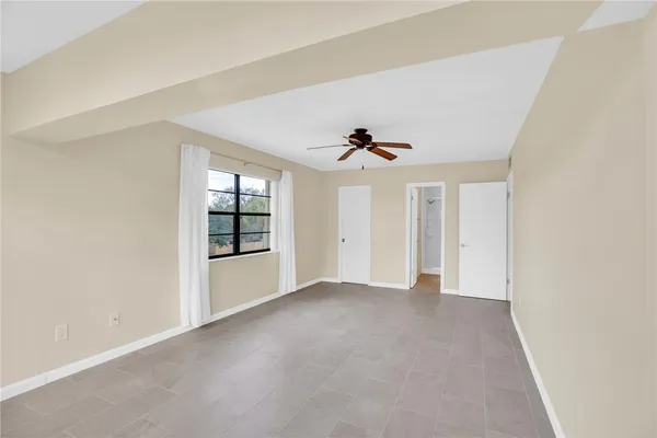 a view of an empty room with a window