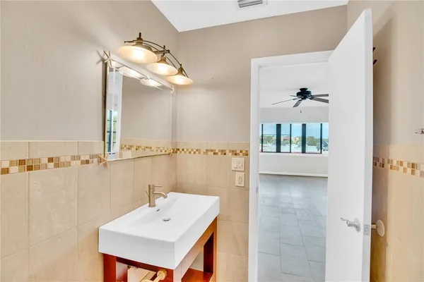 a bathroom with a sink and mirror
