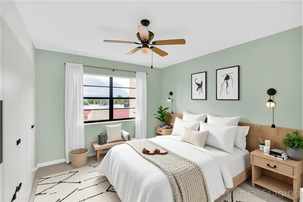 a bedroom with a bed and a window