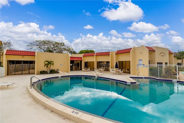 a view of a swimming pool with a patio