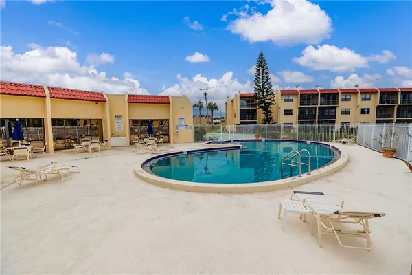 a view of a swimming pool with a patio