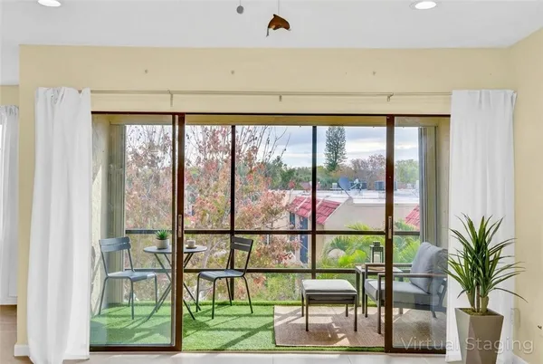 a view of a chairs and table in a room