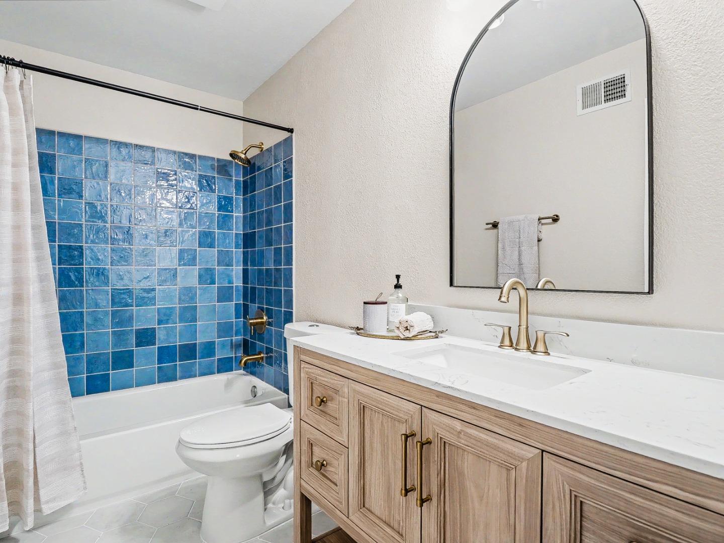 6455 Kensington Place Gilroy, CA 95020 - Photo 23 of 32 a bathroom with a sink a toilet and shower
