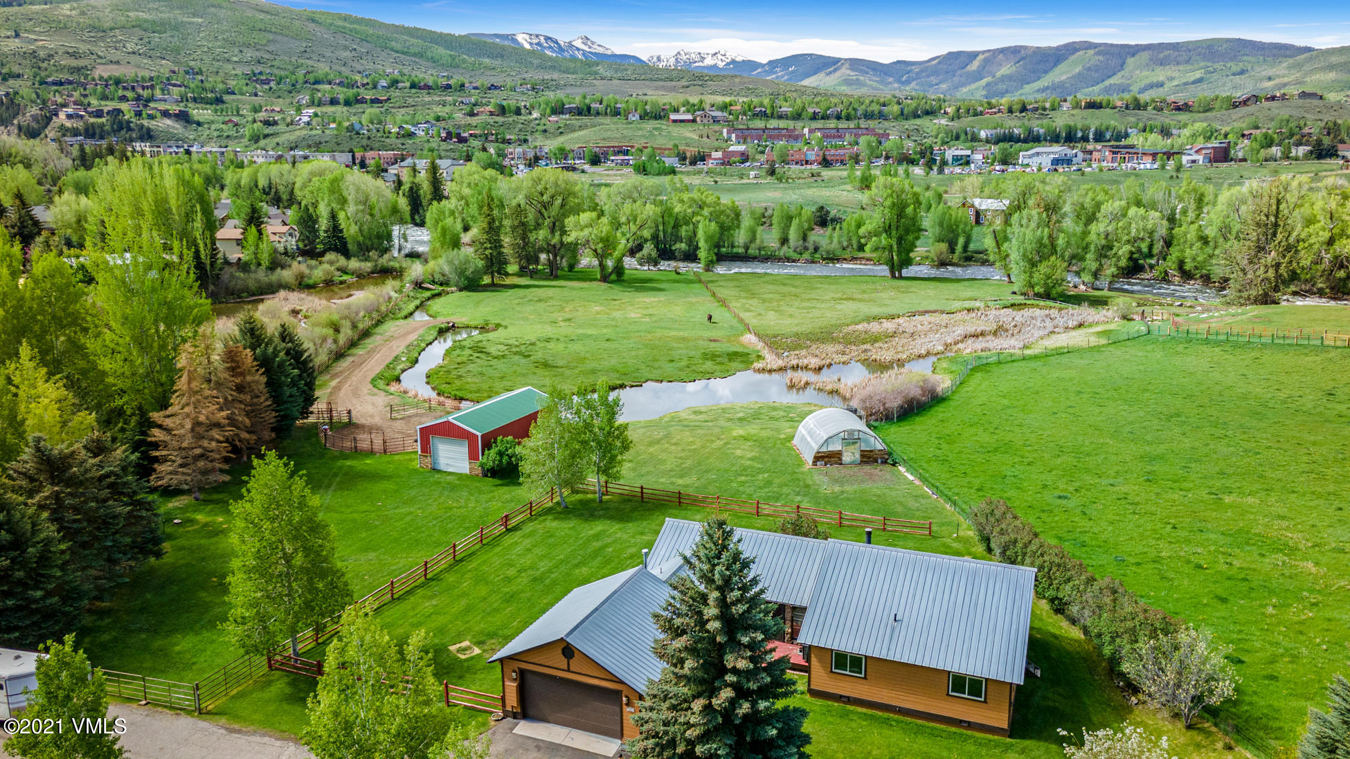 an aerial view of a golf course with parking space