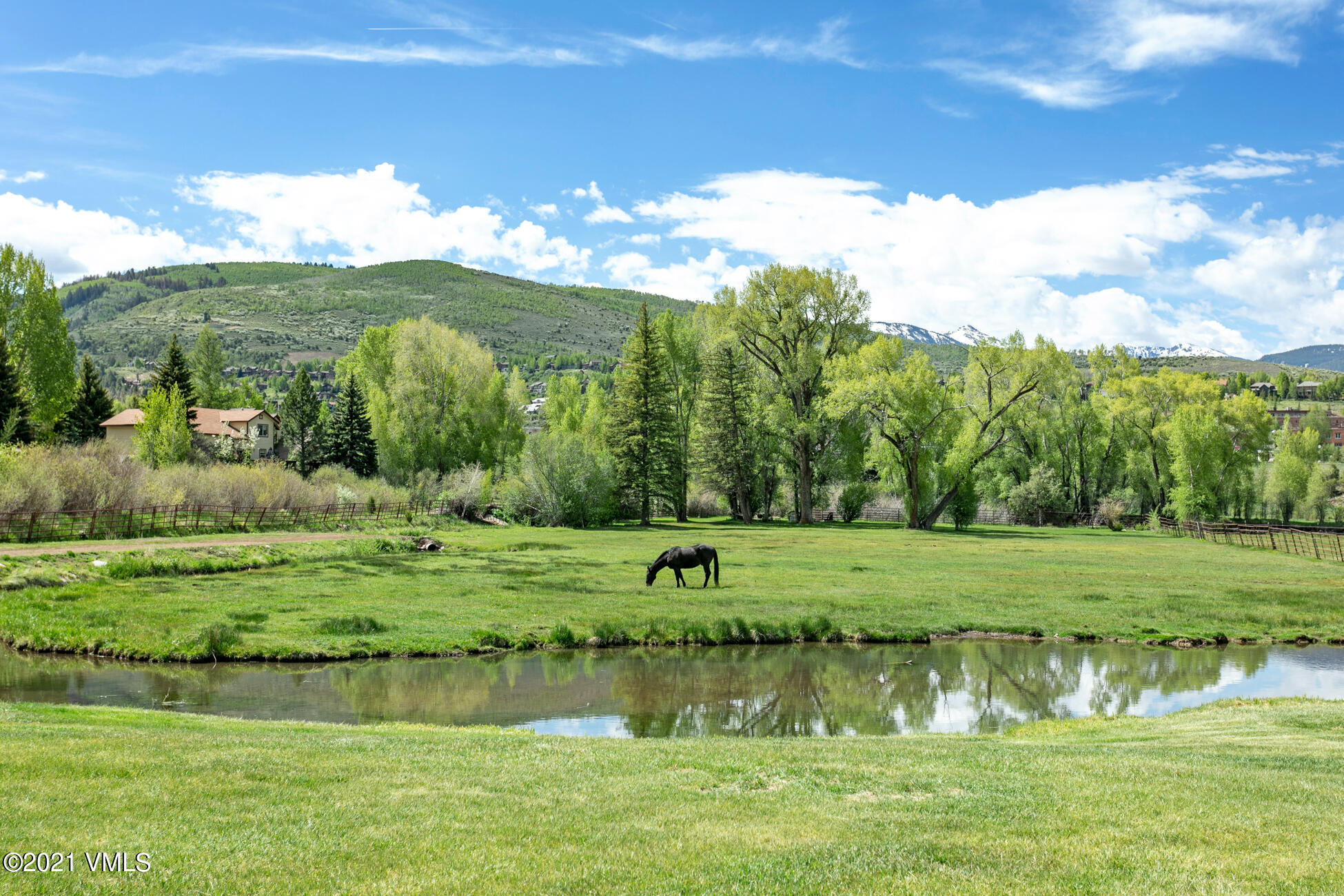 385 Edwards Access Road Edwards, CO 81632 - Photo 14 of 37 a view of a lake with a big yard