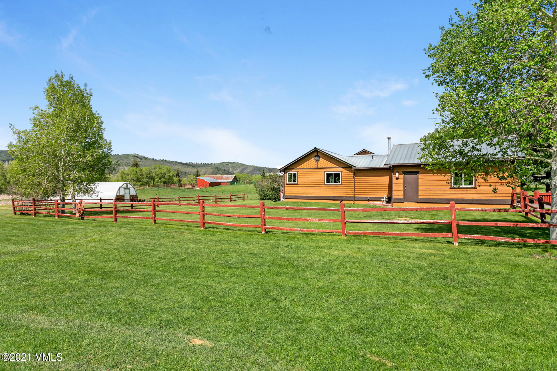 385 Edwards Access Road Edwards, CO 81632 - Photo 22 of 37 a front view of a house with a yard