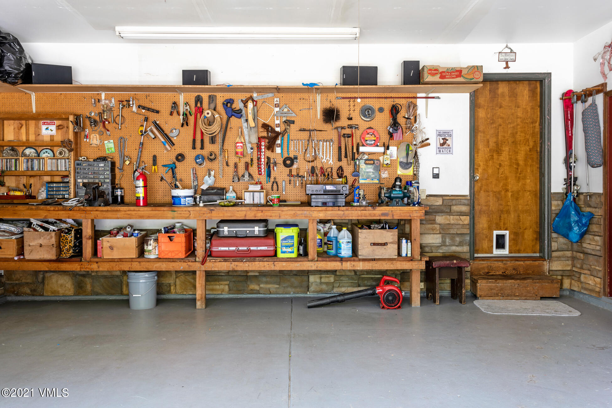 385 Edwards Access Road Edwards, CO 81632 - Photo 24 of 37 a view of a utility room with water heater and racks