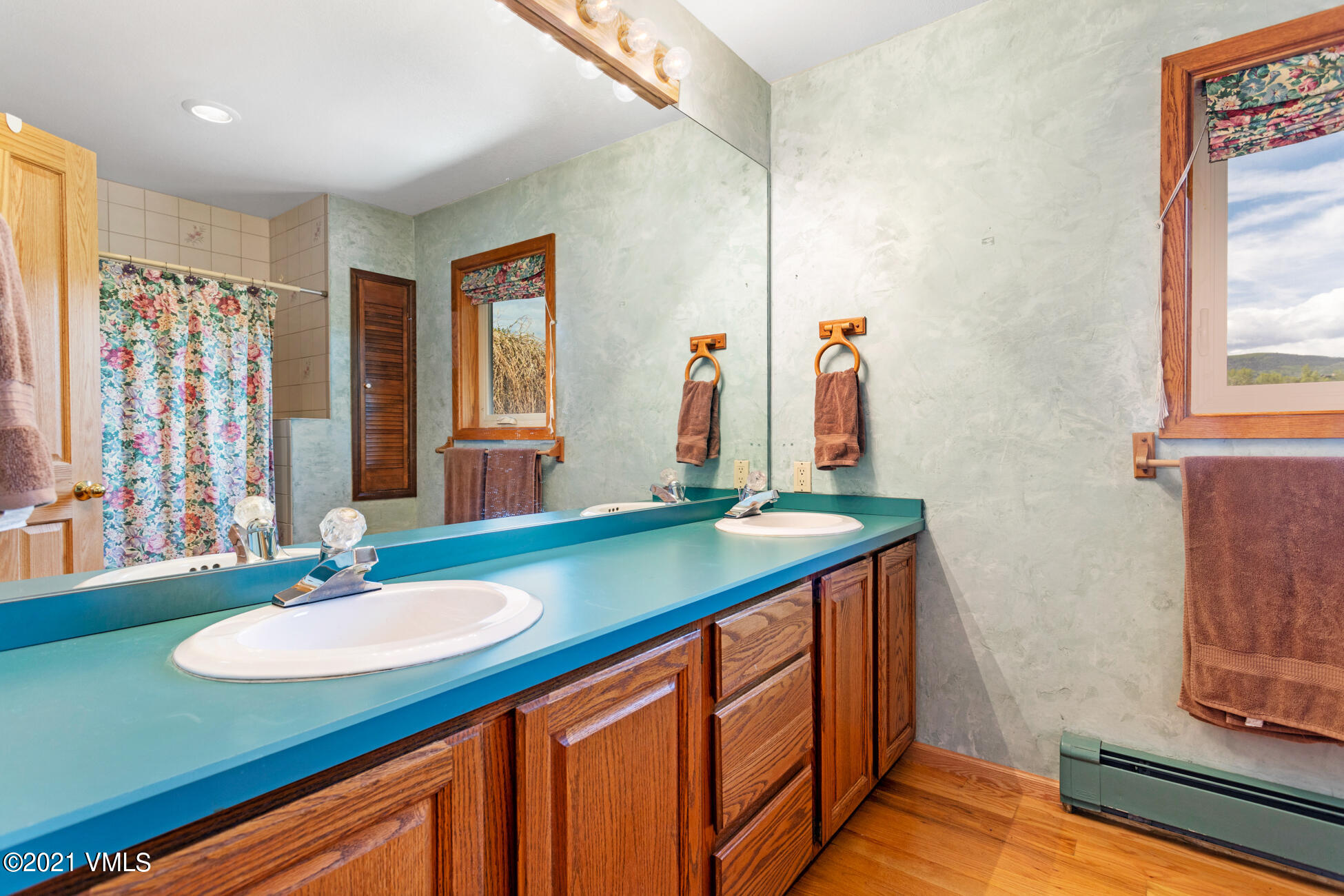 385 Edwards Access Road Edwards, CO 81632 - Photo 33 of 37 a bathroom with a granite countertop sink and a mirror