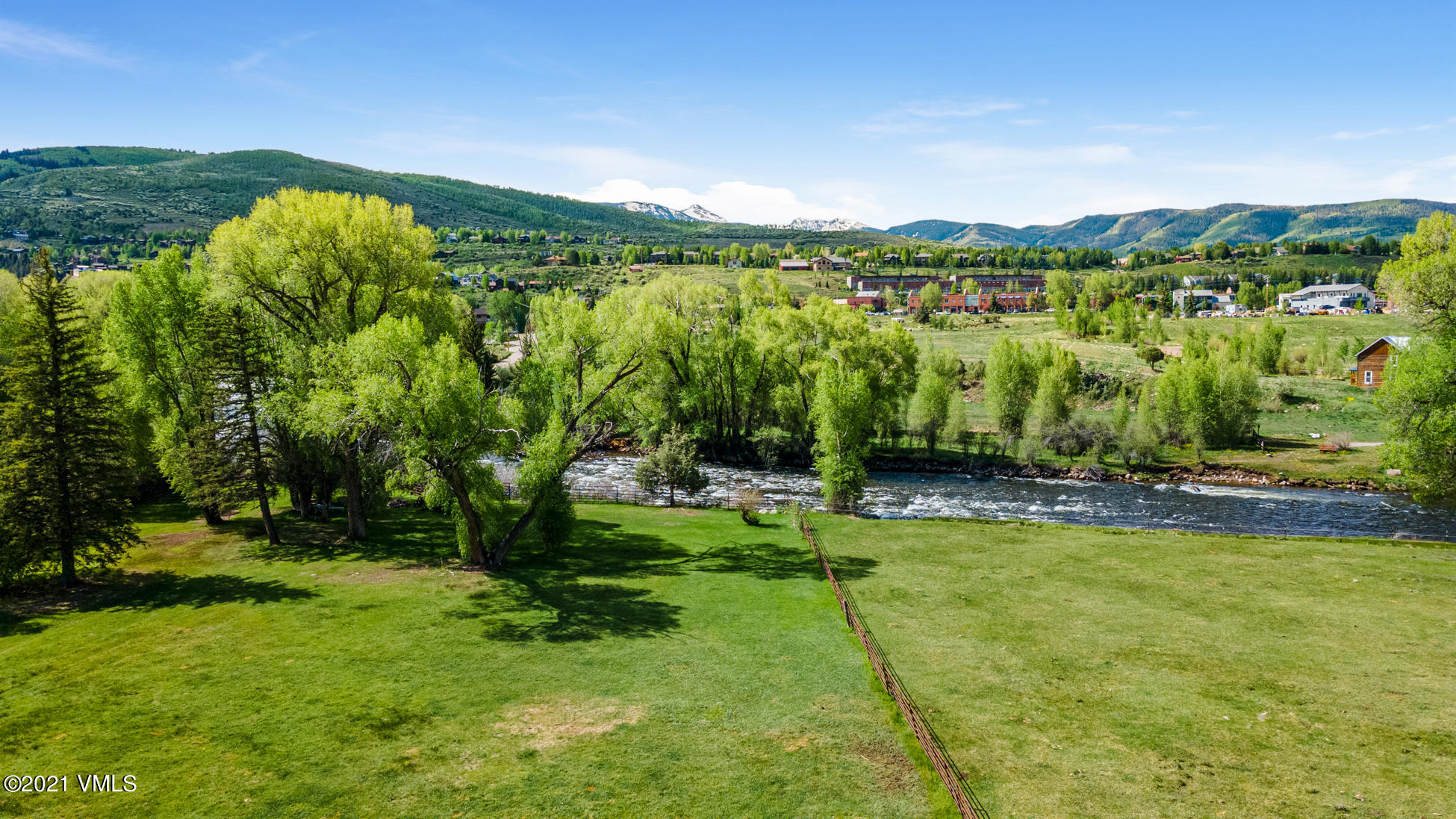 385 Edwards Access Road Edwards, CO 81632 - Photo 7 of 37 a view of a garden with a building in the background