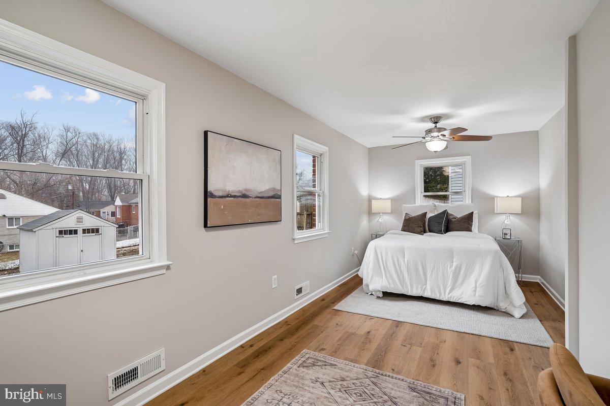 3921 Lantern Drive Silver Spring, MD 20902 - Photo 18 of 46 a bedroom with a large bed and a window