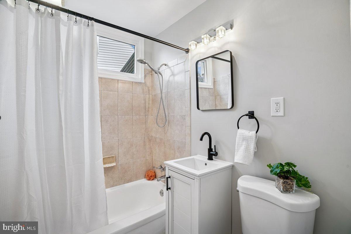 3921 Lantern Drive Silver Spring, MD 20902 - Photo 19 of 46 a bathroom with a sink toilet and shower