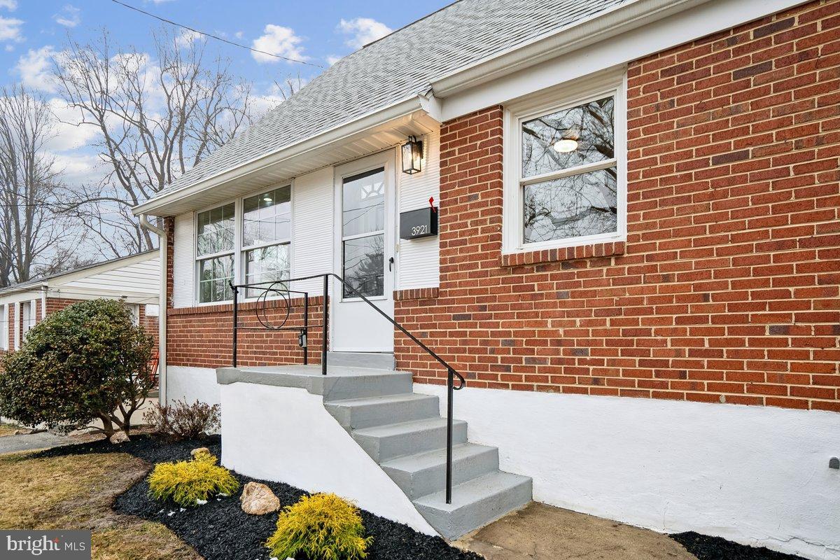 3921 Lantern Drive Silver Spring, MD 20902 - Photo 2 of 46 a front view of a house with a yard