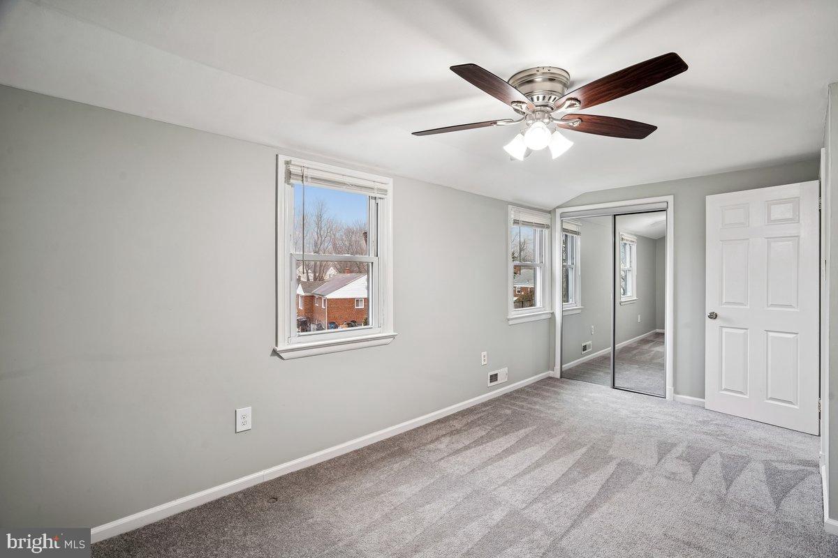 3921 Lantern Drive Silver Spring, MD 20902 - Photo 24 of 46 a view of an empty room with a ceiling fan