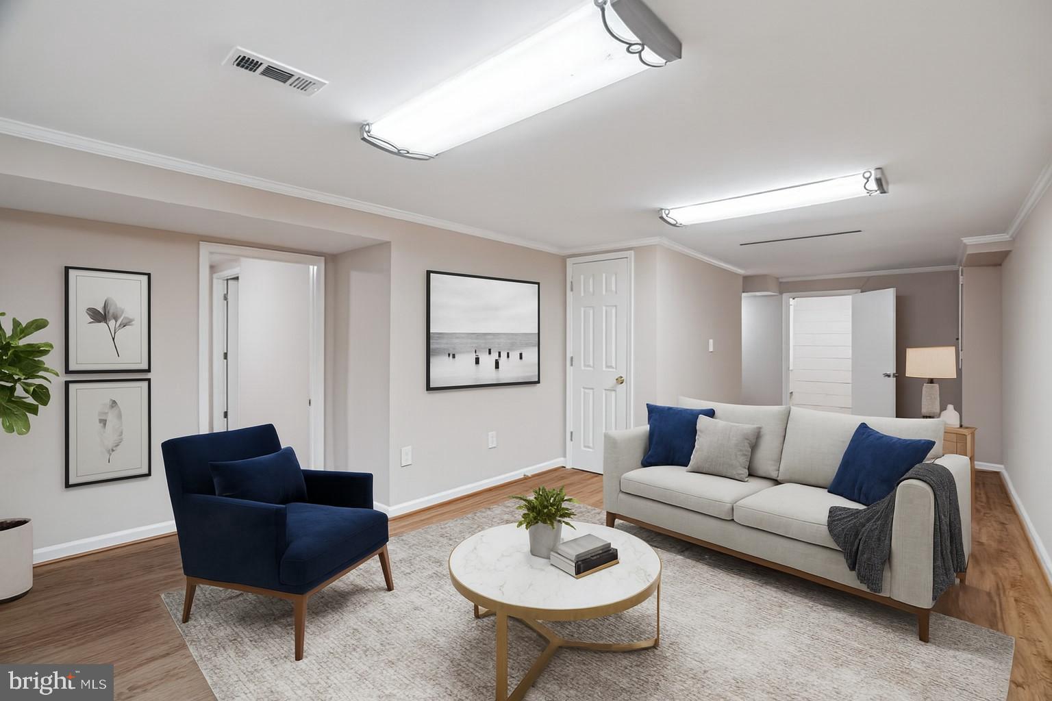 3921 Lantern Drive Silver Spring, MD 20902 - Photo 28 of 46 a living room with furniture and a wooden floor