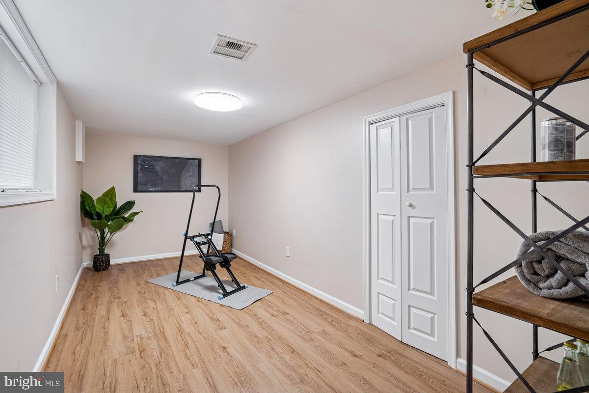 3921 Lantern Drive Silver Spring, MD 20902 - Photo 30 of 46 a view of a workspace with furniture and wooden floor