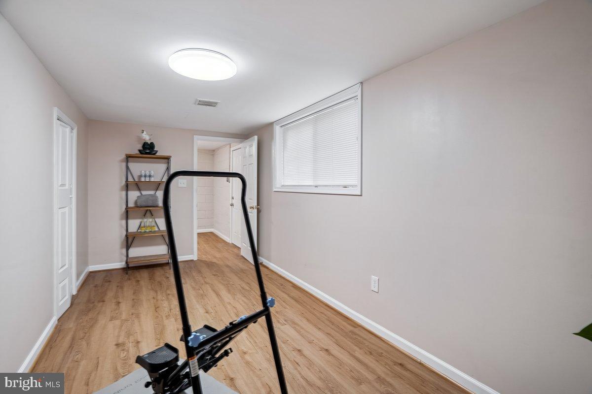3921 Lantern Drive Silver Spring, MD 20902 - Photo 31 of 46 a view of a room with furniture and wooden floor