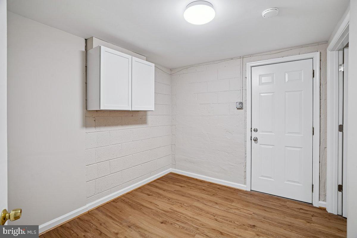 3921 Lantern Drive Silver Spring, MD 20902 - Photo 32 of 46 a view of empty room with wooden floor