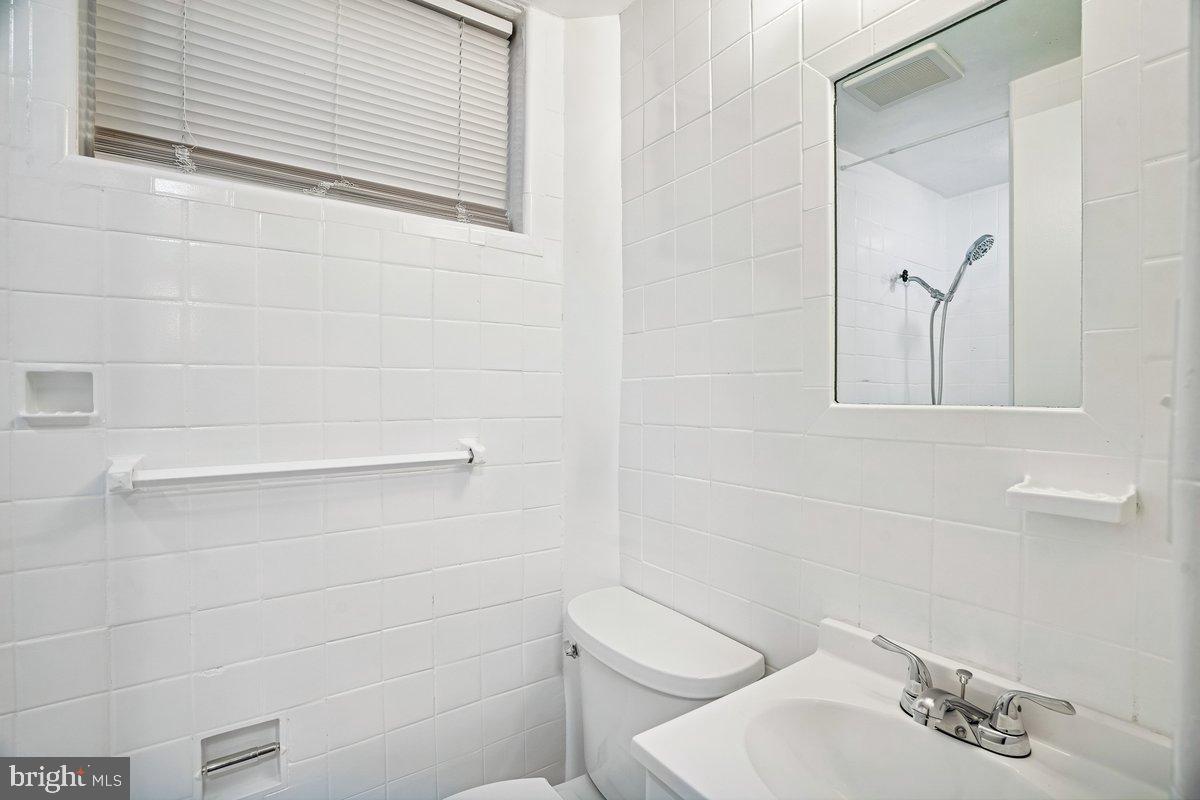 3921 Lantern Drive Silver Spring, MD 20902 - Photo 33 of 46 a bathroom with a toilet and a sink