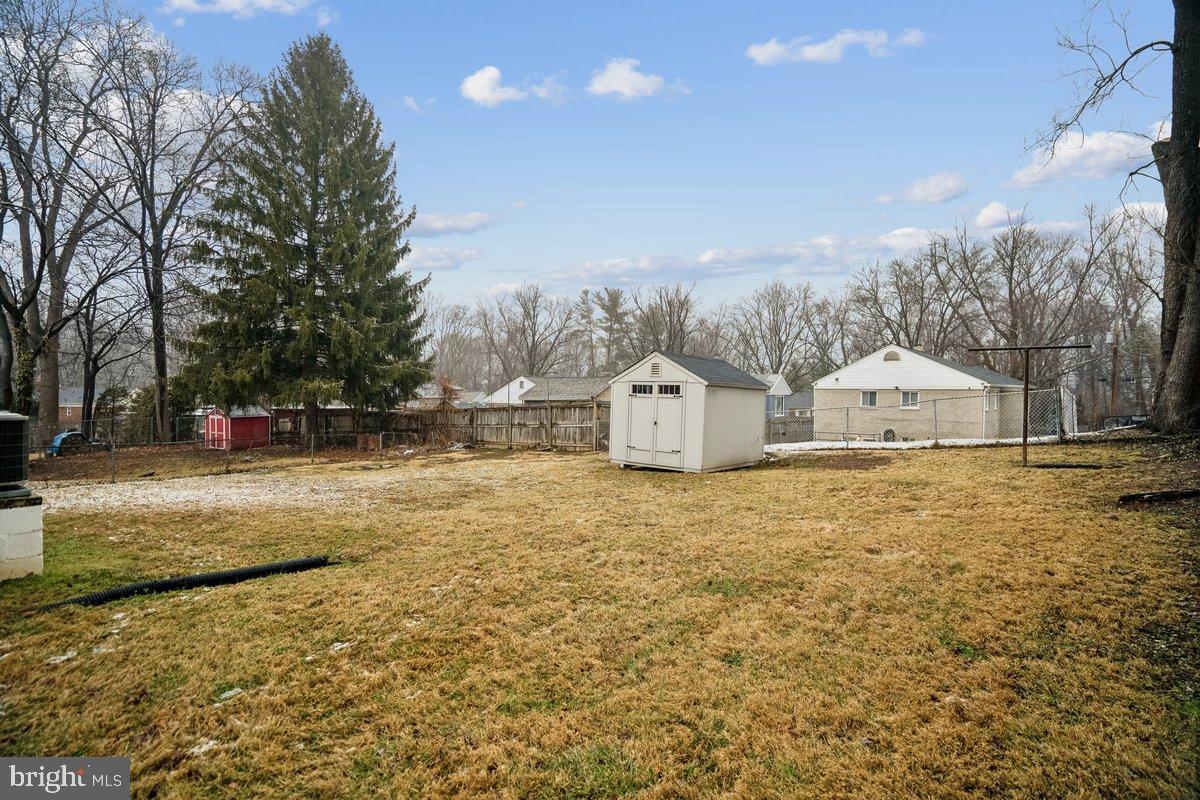 3921 Lantern Drive Silver Spring, MD 20902 - Photo 38 of 46 a bathroom with a sink and a large mirror