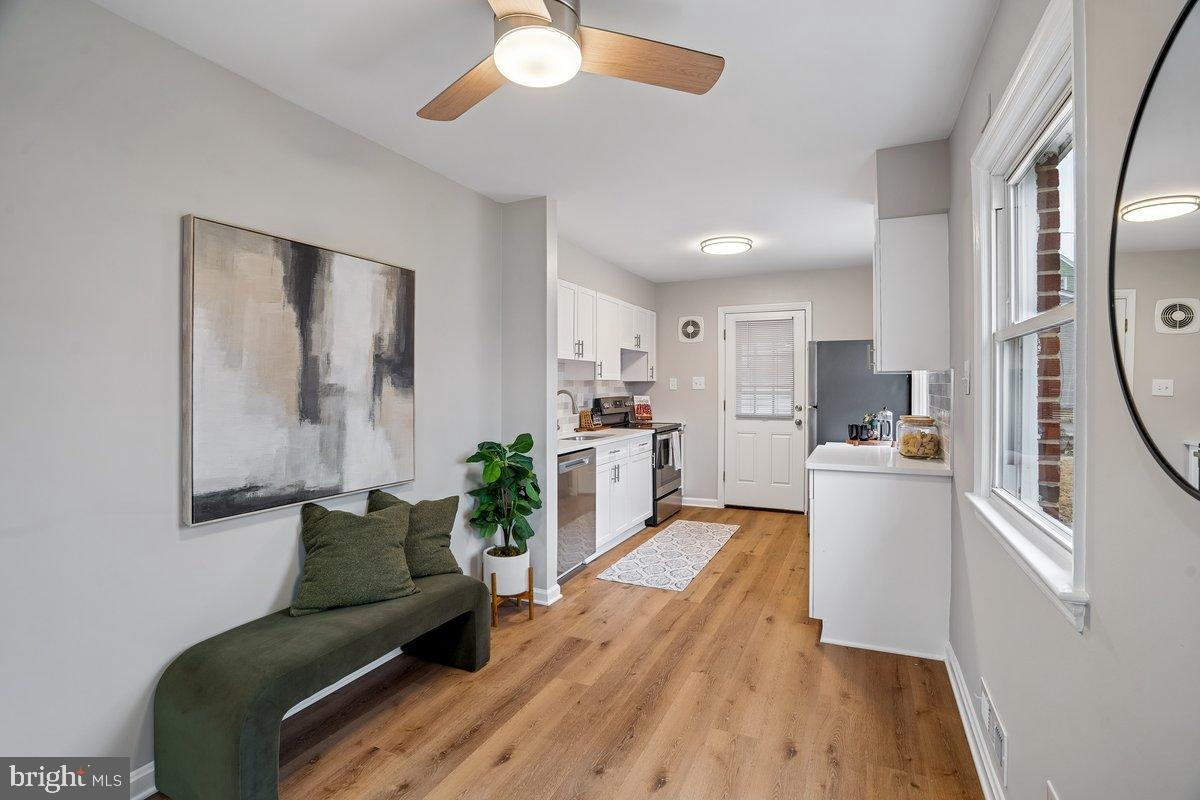 3921 Lantern Drive Silver Spring, MD 20902 - Photo 4 of 46 a living room with furniture and a wooden floor