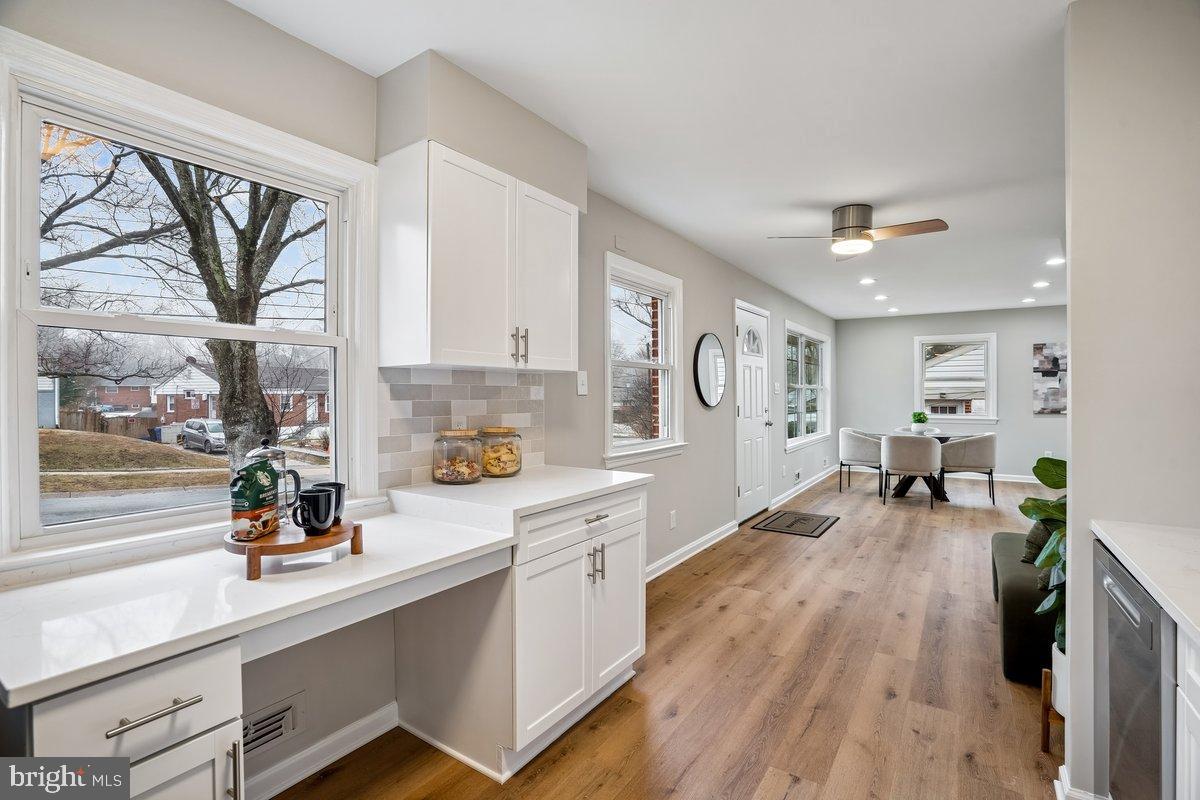 3921 Lantern Drive Silver Spring, MD 20902 - Photo 6 of 46 a very nice looking living room with a large window and wooden floors