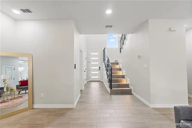 a view of a hallway view with staircase