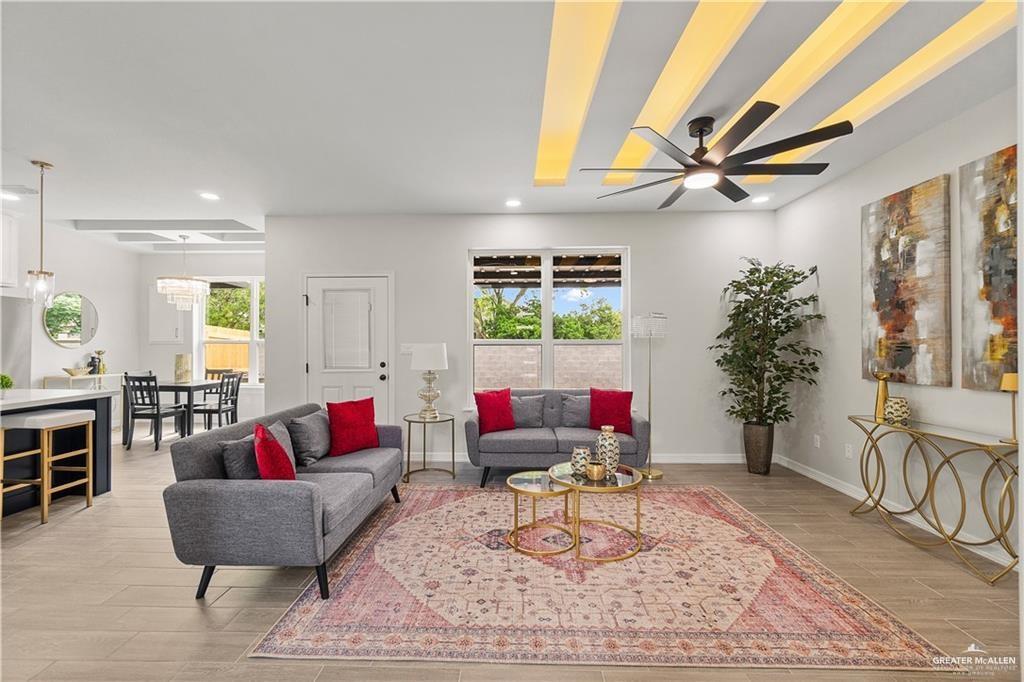 5516 North Crown Point Pharr, TX 78577 - Photo 5 of 27 a living room with furniture and a large window