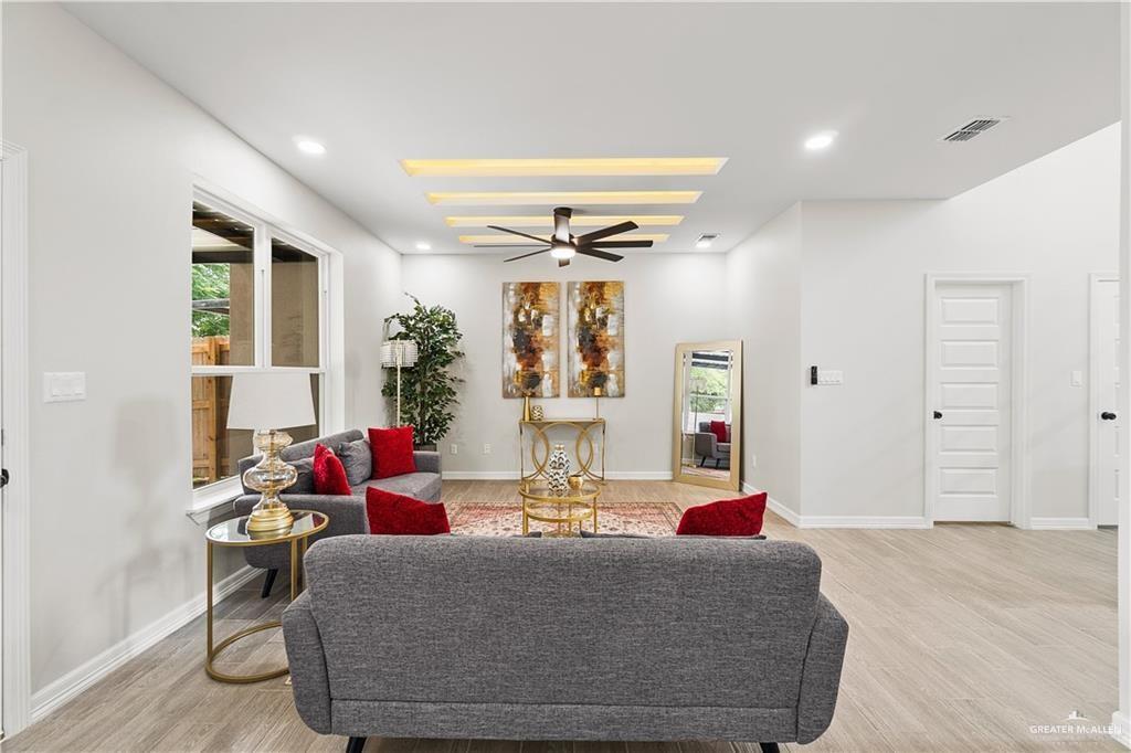 5516 North Crown Point Pharr, TX 78577 - Photo 7 of 27 a living room with furniture and a large window