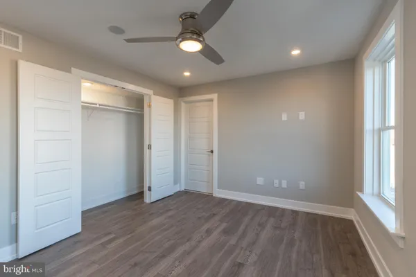 a bathroom with a double vanity sink mirror and shower