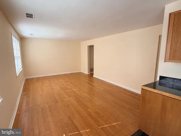 a view of a bathroom with wooden floor