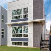 a view of front door of house with a yard