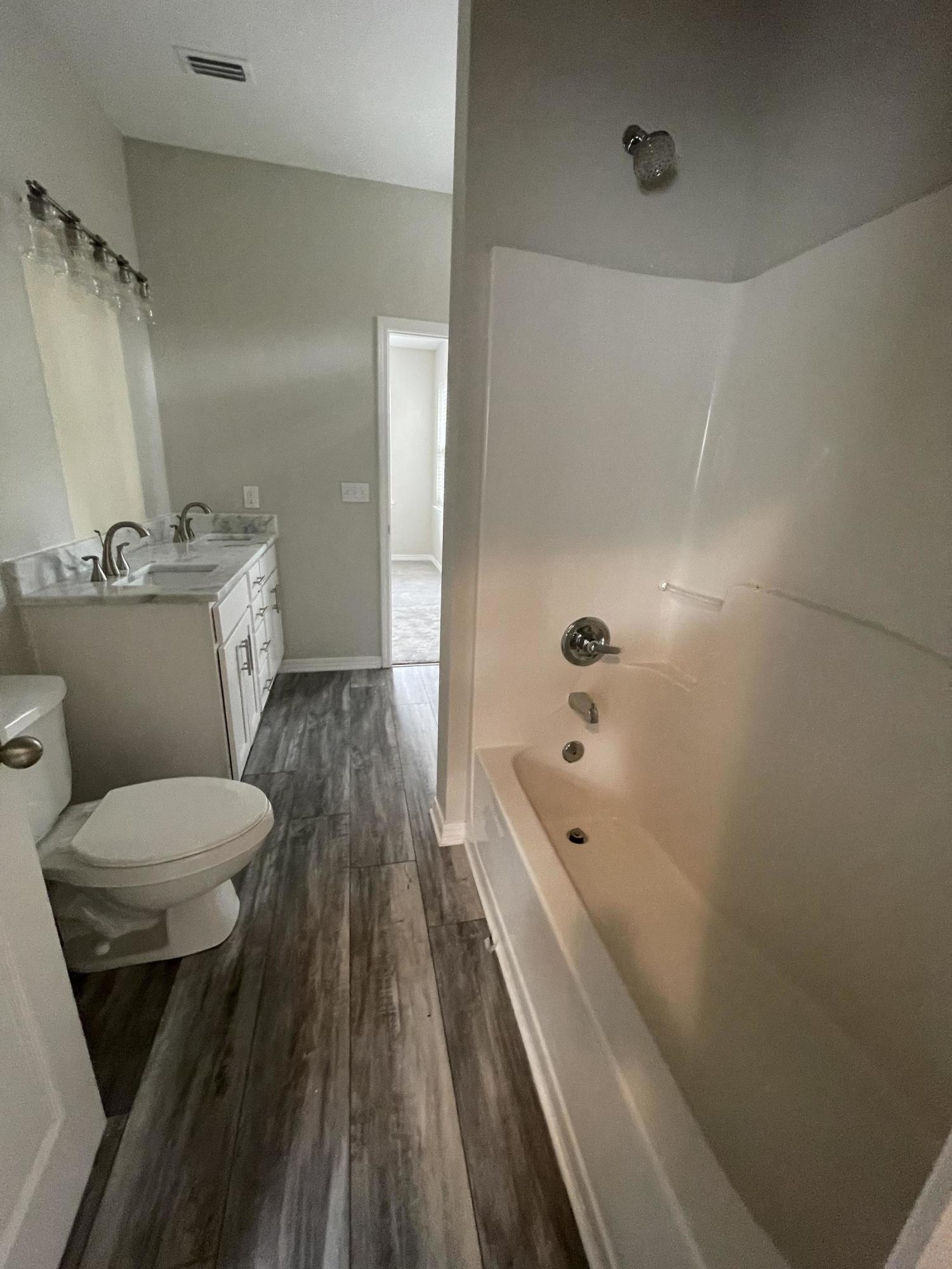 47 15th Street Santa Rosa Beach, FL 32459 - Photo 13 of 20 a bathroom with a sink a toilet and shower