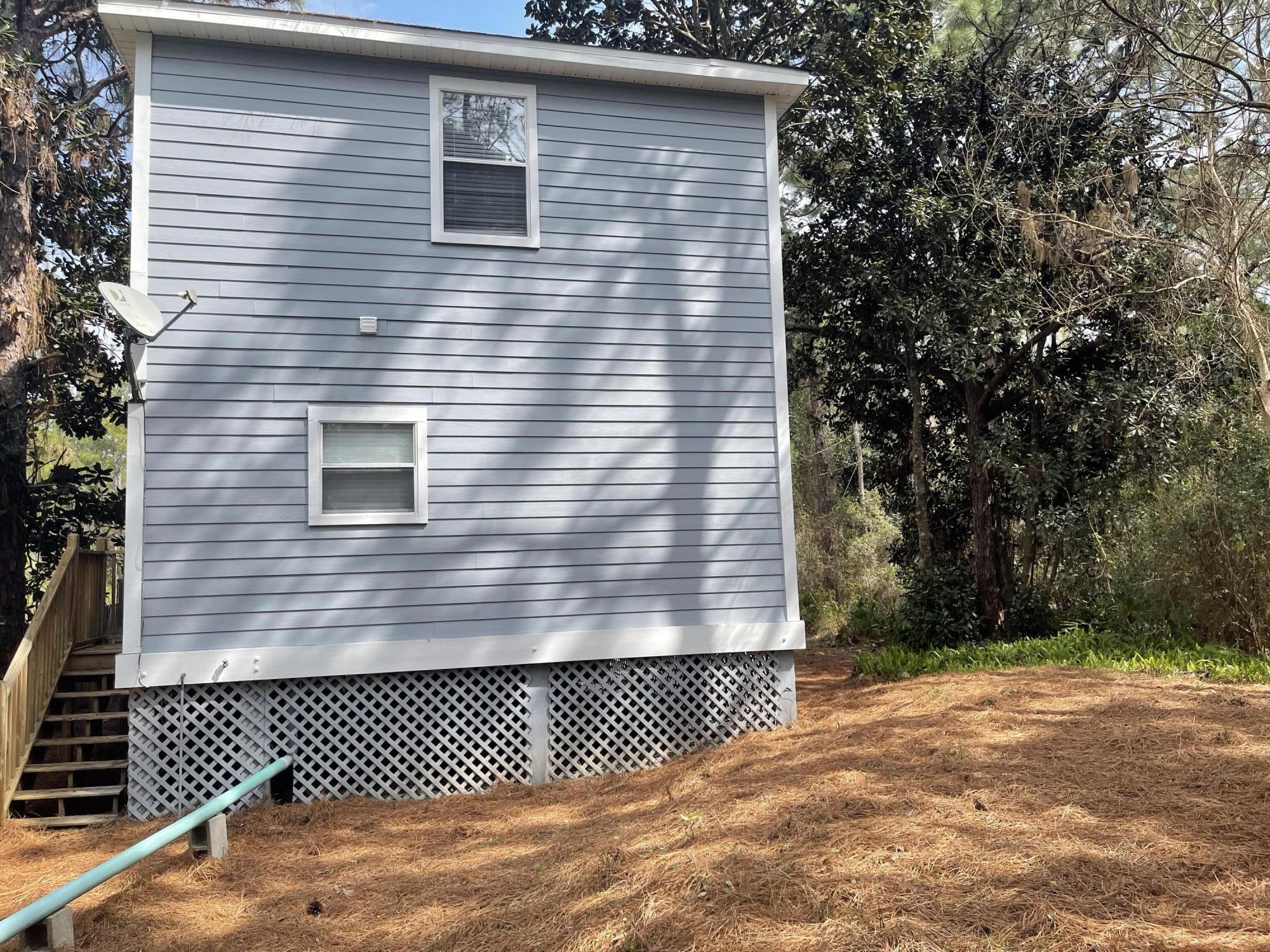 47 15th Street Santa Rosa Beach, FL 32459 - Photo 15 of 20 a view of a house with a wooden fence